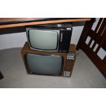 Two vintage television sets and bakelite radio case