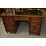 A late Victorian mahogany desk in the Aesthetic style, later skiver leather top and mounted on