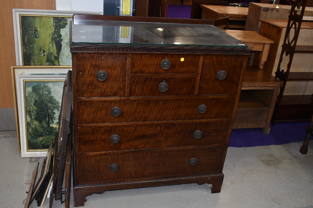 An early 20th Century mahogany bedroom chest by Waring & Gillow, intersting arrangement of two small