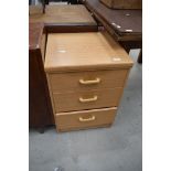 A modern laminate chest of three bedroom or similar drawers