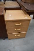A modern laminate chest of three bedroom or similar drawers