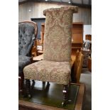 A Victorian prie dieu (prayer) chair, having later upholstery