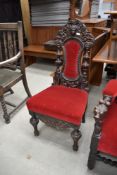A late 19th Century Carolean style dining chair, heavily carved