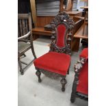 A late 19th Century Carolean style dining chair, heavily carved