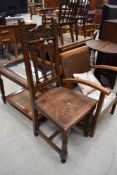 A late 19th/early 20th Century oak carved hall chair