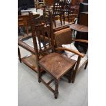 A late 19th/early 20th Century oak carved hall chair