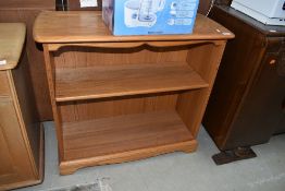 A modern medium stained set of shelves by Ercol, approx. D38cm W90cm H84cm