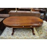 A hard wood reproduction coffee table having carved leg and frame work, dimensions approx. W89,