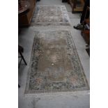 Two oriental style silk fireside rugs, approx. 156 x 92cm and 183 x 120cm