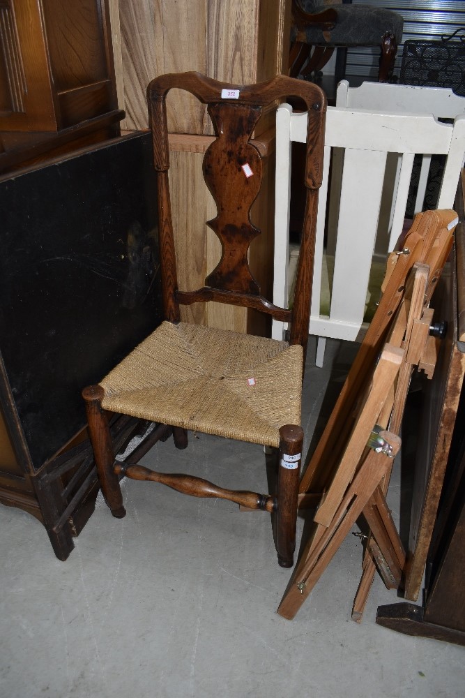 A period oak and elm vase back chair having later strung seagrass style seat