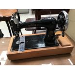 A hand cranked Singer sewing machine with case P199346