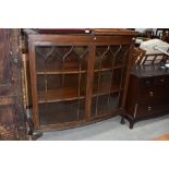 An early 20th Century mahogany display cabinet, on ball and claw feet, width approx. 120cm