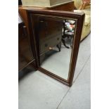 A modern mahogany effect wall mirror, approx. 85 x 61cm