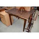 An early to mid 20th Century formica topped drawer leaf table