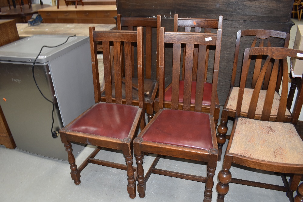 A set of four dining chairs having vinyl seats