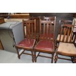 A set of four dining chairs having vinyl seats