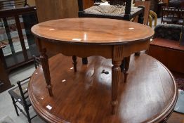 A reproduction mahogany Adams style oval coffee table, width approx. 69cm