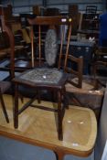 A spindle back antique maids bedroom chair