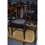 A spindle back antique maids bedroom chair