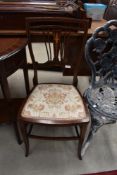 An Edwardian mahogany and inlaid bedroom chair