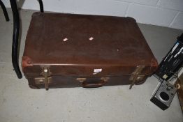 A vintage leather bound suit or carry case