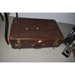 A vintage leather bound suit or carry case