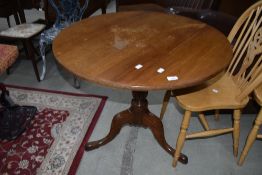 A 19th Century light mahogany pedestal table on turned base and triple splay legs