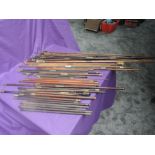 A collection of vintage Gun Cleaning Rods with mixed heads and handles, brass fittings, mixed woods,