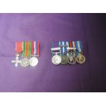 A group of three miniature medals The Order of the British Empire Medal Defence Medal and War