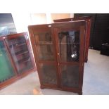 A mahogany and glazed free standing upright Gun Cabinet, spaces for 8 guns, width 96cm, height