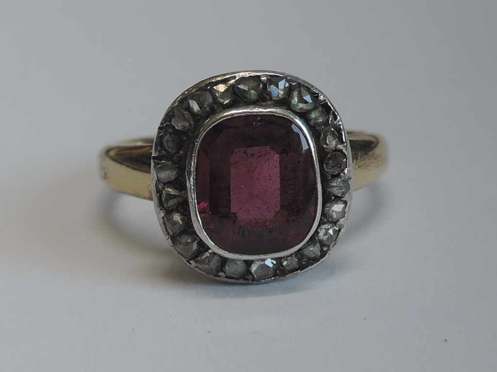 A lady's dress ring having a central pink stone possibly tourmaline in a collared mount with diamond - Image 3 of 5