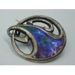 A silver brooch of Art Nouveau design having iridescent enamelled decoration, Chester, possibly