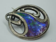 A silver brooch of Art Nouveau design having iridescent enamelled decoration, Chester, possibly