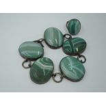 A green stripe agate bracelet having five oval panels in white metal mounts with chain links, no