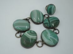 A green stripe agate bracelet having five oval panels in white metal mounts with chain links, no
