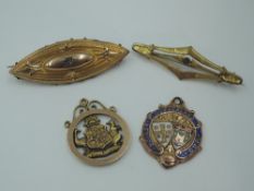 A small selection of 9ct gold and yellow metal including Cumberland football medal, bar brooches,