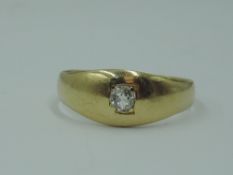 A gent's yellow metal band ring of plain form having an old cut diamond insert, approx 0.128ct, no