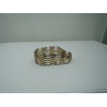 A 9ct gold six bar bracelet having twist bar decoration and padlock clasp, GW approx 14.3g