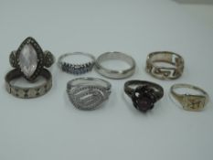 Eight white metal dress rings, most stamped 925