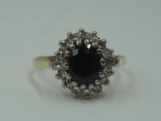 A lady's dress ring having a sapphire and diamond oval cluster having brilliant cut and baguette cut