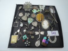 A selection of white metal jewellery including pendants, filligree brooches,enamelled bird brooch,