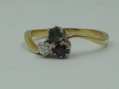 A lady's dress ring having a diamond,emerald and ruby trio, each stone approx 0.125ct in claw set