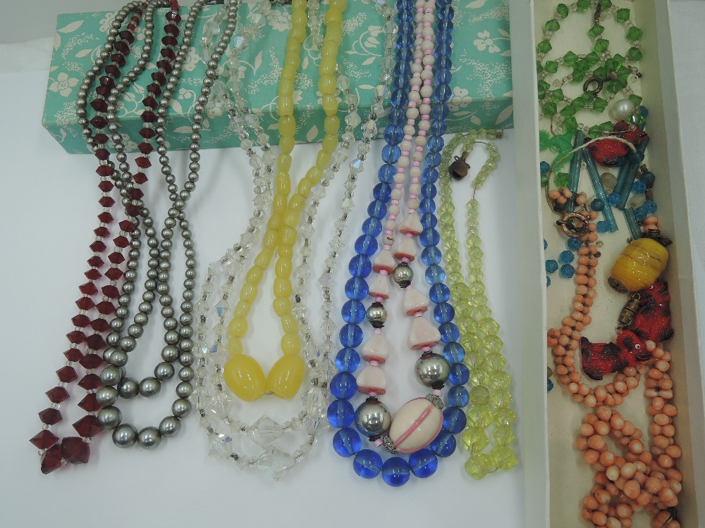 Seven strings of beads including crystal, glass, facetted glass etc and a small selection of