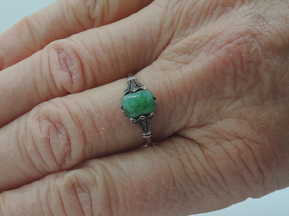 A lady's dress ring having a rectangular jadeite style stone in a claw set basket mount with - Image 2 of 2