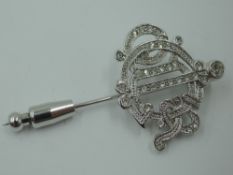 A vintage Christian Dior monogram pin having rhinestone decoration