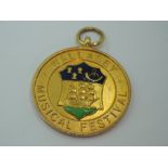 A 9ct gold medal regarding Wallasey Music festival dated 1935, approx 8g