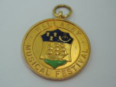 A 9ct gold medal regarding Wallasey Music festival dated 1935, approx 8g