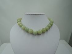 A string of Jadeite style beads of large even form, diameter approx 12mm, approx 16' & 119g