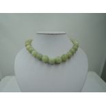 A string of Jadeite style beads of large even form, diameter approx 12mm, approx 16' & 119g