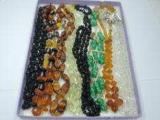 A small selection of vintage strings of beads of various forms